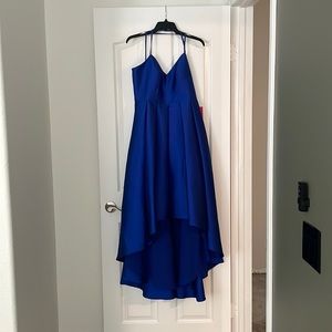 Never been worn, royal blue formal dress. It’s a high low dress.